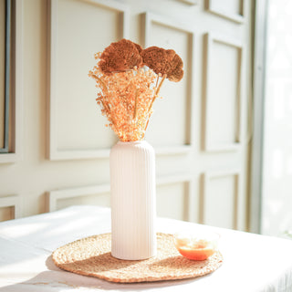 Golden harvest bunch with snow white vase